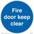 Fire door keep clear sign